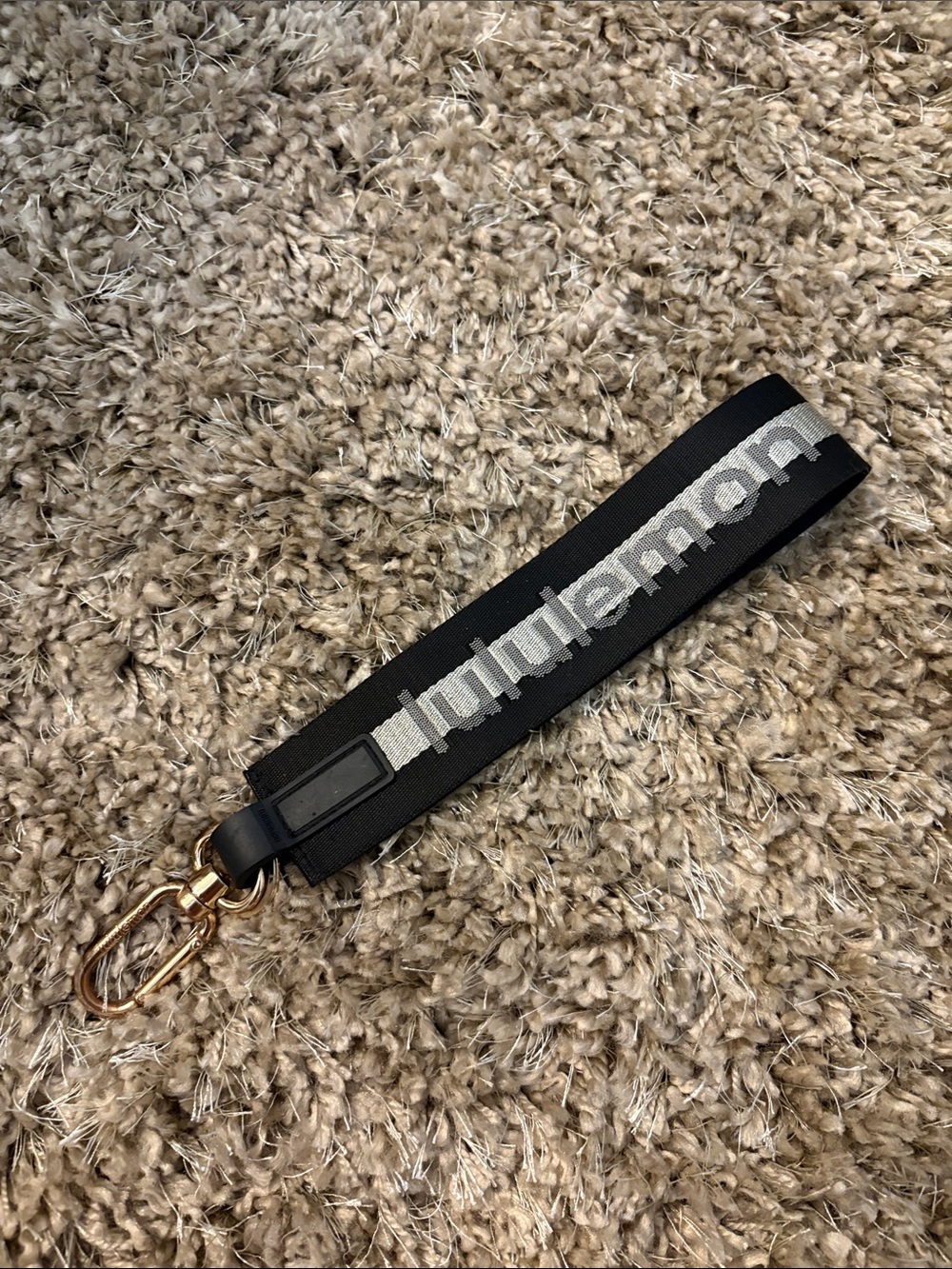 Black and gold Lululemon wristlet